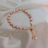 Armband mit rosa Gänseblümchen in Gold