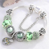 Bracelet en or blanc avec cristal vert