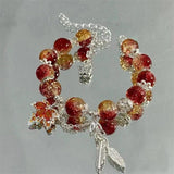 Bracelet feuille d'automne et papillon en or blanc