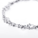 Bracelet à pendentifs pattes de chien et os en or blanc