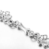 Bracelet à pendentifs pattes de chien et os en or blanc