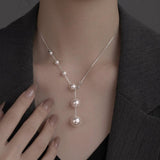 Collier élégant à perles pendantes