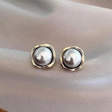 Boucles d'oreilles élégantes à perle noire