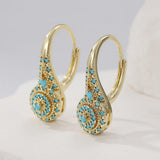 Cluster de puces d'oreilles doré avec turquoise