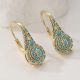 Cluster de puces d'oreilles doré avec turquoise