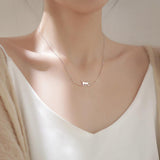 Collier chat grimpeur en or blanc