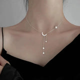 Collier lune et étoiles en or blanc