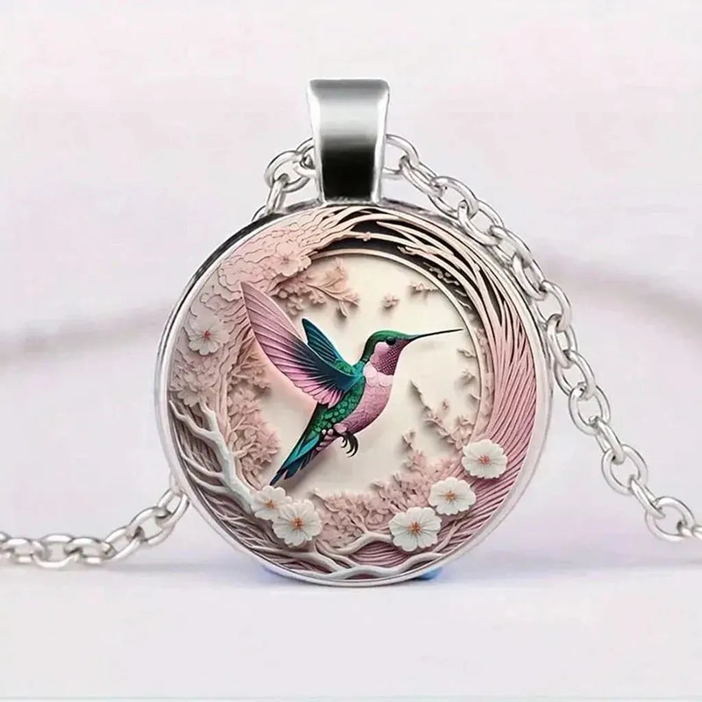 Pendentif hirondelle sous dôme de verre