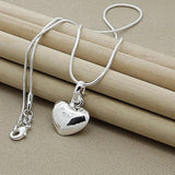 Collier cœur en or blanc