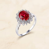 Bague classique rubis avec entourage or blanc