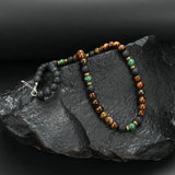 Collier perles œil de tigre et fermoir doré