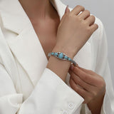 Jonc ouvert gouttes turquoise | Or blanc
