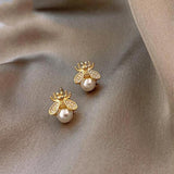 Boucles d'oreilles perle et zircones en or