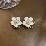 Boucles d'oreilles en or blanc avec zircones