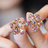 Boucles d'oreilles en or blanc avec zircones colorées