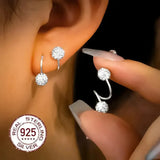 Boucles d'oreilles double spirale et zircones