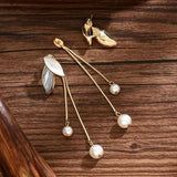 Boucles d'oreilles en forme de feuille avec marguerites
