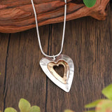 Collier rétro pendentif cœur en or blanc et or