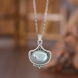 Ensemble rétro : collier et boucles d'oreilles pierres ovales bleues