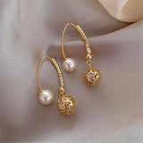 Boucles d'oreilles pendantes rétro en or avec marguerites