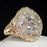 Bague rétro en or blanc pierre rouge et zircones