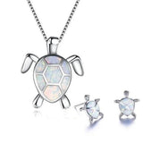 Ensemble : collier et boucles d'oreilles tortue de mer opale et or blanc