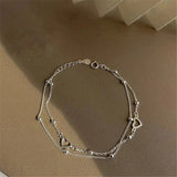 Bracelet ajustable en or blanc avec cœur