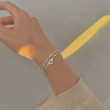 Bracelet ajustable en or blanc avec cœur