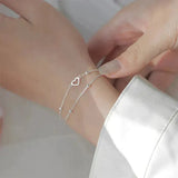 Bracelet ajustable en or blanc avec cœur