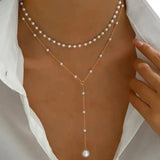Collier de perles deux rangs avec pendentifs