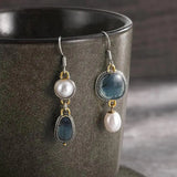 Boucles d'oreilles asymétriques pierres bleues et perle