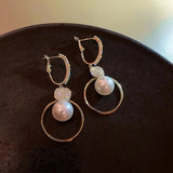 Boucles d'oreilles perle et disque de zircones